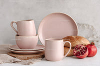 Pink Ceramic Mugs and Pomegranate on Rustic Wooden Serving Board