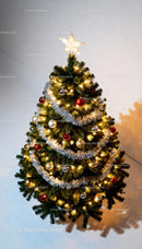 Decorated Christmas tree with glowing star topper and lights