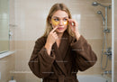 Young Woman Applying Facial Masks in Bathroom Bathroom