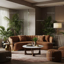 Cozy Modern Living Room with Brown Velvet Sofa and Green Plants