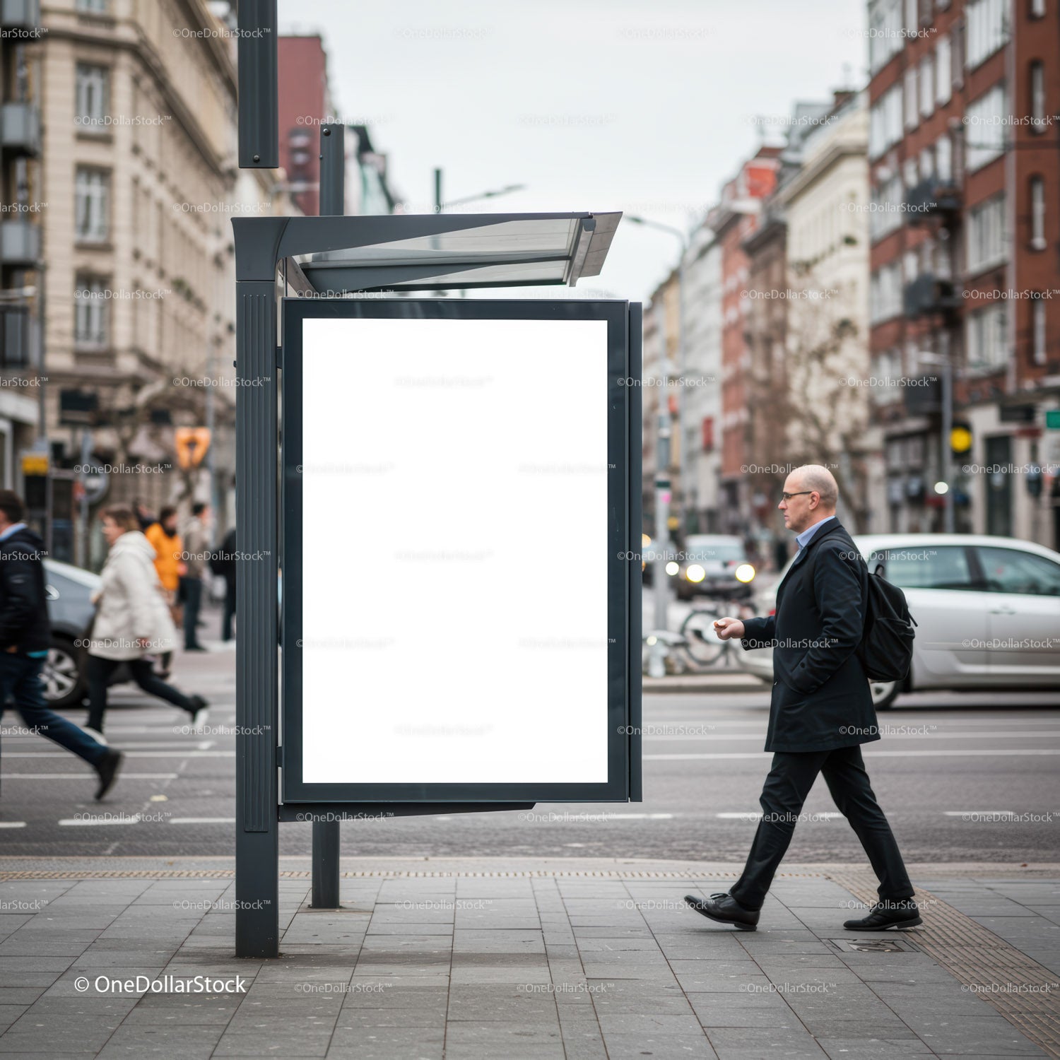 Man walking past blank advertising board in city street