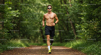 Male Athlete Running in Nature Trail with Prosthetic Leg