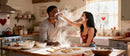 Couple Playfully Baking Heart Shaped Cookies Together