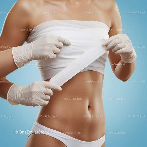 Woman Applying Medical Bandage on Abdomen in Healthcare Setting