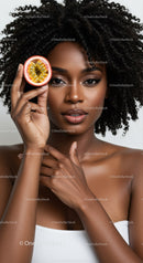 Elegant Portrait of a Woman with Curly Hair Holding Passion Fruit in Studio