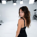 Young Woman in Black Fashion Dress During Studio Photoshoot
