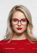 Elegant Woman with Blonde Hair and Red Glasses in Studio Portrait