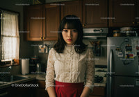 Portrait of Young Woman in Elegant Lace Blouse and Red Skirt in Kitchen