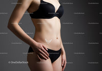 Elegant Woman in Black Lingerie Showcasing Fitness and Confidence