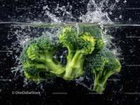 Fresh Green Broccoli Florets in Water Splash Artistic Composition