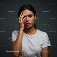 Confused and Frustrated Woman Touching Her Face in Portrait