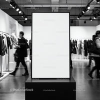 Blank vertical poster frame in modern clothing store