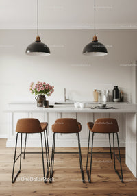 Modern kitchen with white cabinets, black pendant lights, and pink floral decor