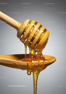 Wooden Honey Dipper Drizzling Golden Honey