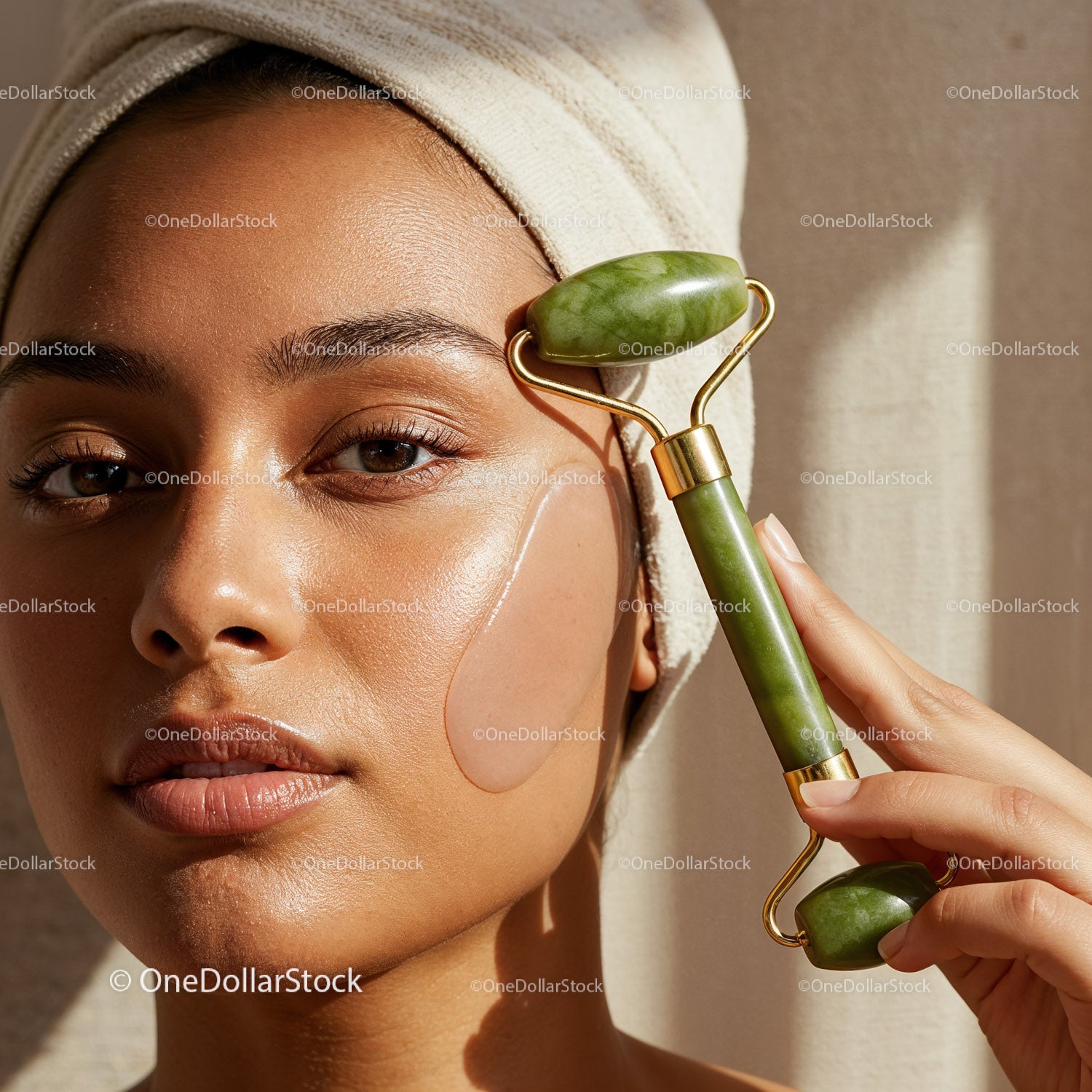 Young Woman Using Jade Facial Roller for Skin Rejuvenation and Relaxation