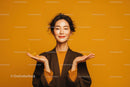 Confident Young Woman Smiling with Yellow Background and Casual Fashion