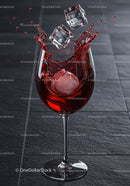 Ice Cubes Dropping into Glass of Red Wine Splash