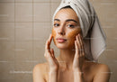 Woman Applying Facial Mask for Skincare and Relaxation