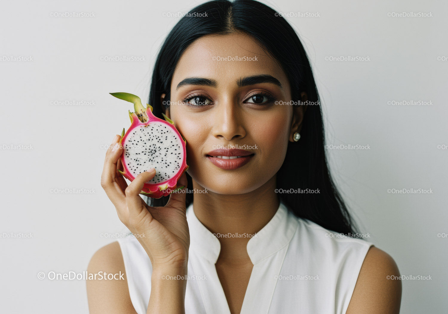 Portrait of a Woman Holding a Dragon Fruit with Bright Natural Lighting