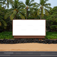 Blank billboard on tropical roadside with palm trees