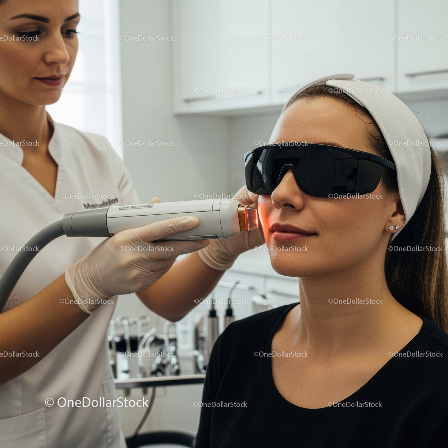 Woman receiving laser skin rejuvenation treatment in professional clinic