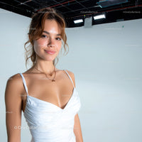 Elegant Young Woman with Bright Smile in a Studio Portrait
