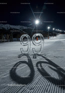 Ice Sculpture Number 99 on Snowy Slope at Night
