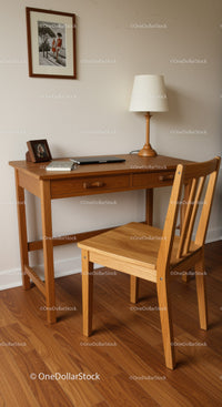Wooden Desk and Chair Set with Table Lamp in Cozy Home Office