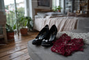 Chic Black Heels and a Red Lace Dress in a Cozy Bedroom Setting