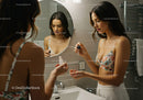 Young Woman Applying Nail Polish in Bathroom Mirror
