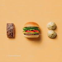 Gourmet Burger with Lettuce and Tomato Next to Grilled Steak and Dumpling