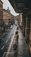 Urban City Street Scene with Pedestrians and Historic Buildings