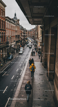 Urban City Street Scene with Pedestrians and Historic Buildings