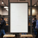 Blank vertical poster board in modern urban cafe interior