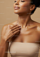Elegant Woman Applying Skincare with Flawless Skin Quality