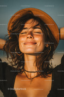 Smiling Woman Enjoying Sunny Day Wearing Hat and Casual Outfit