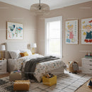 Children's Bedroom with Colorful Wall Art and Cozy Decor