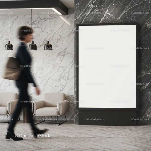 Businesswoman walking past empty black frame in lobby JPG Mockup Image