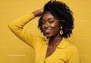 Vibrant African American Woman in Yellow Outfit with Curly Hair