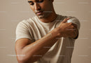 Man Applying Body Lotion with Skincare Routine in Neutral Setting