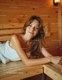 Relaxed Woman Lying on Wooden Bed in Cozy Interior