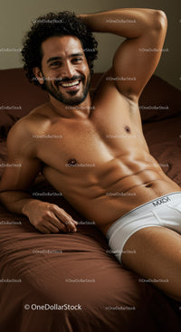 Smiling man relaxing in white underwear on brown bed