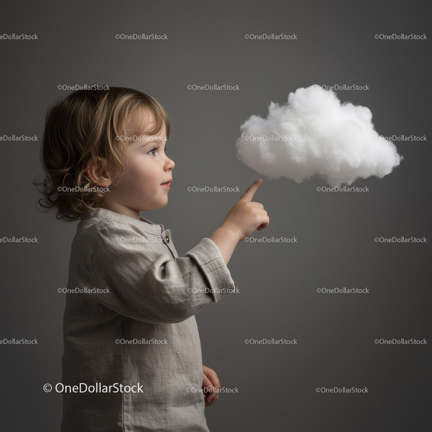 Toddler interacting with a floating soft cloud shape