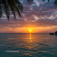 Beautiful Sunset Over Calm Ocean with Palm Trees and Scenic Sky