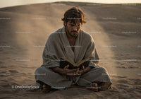 Man Sitting Cross-Legged Reading Book in Desert Landscape