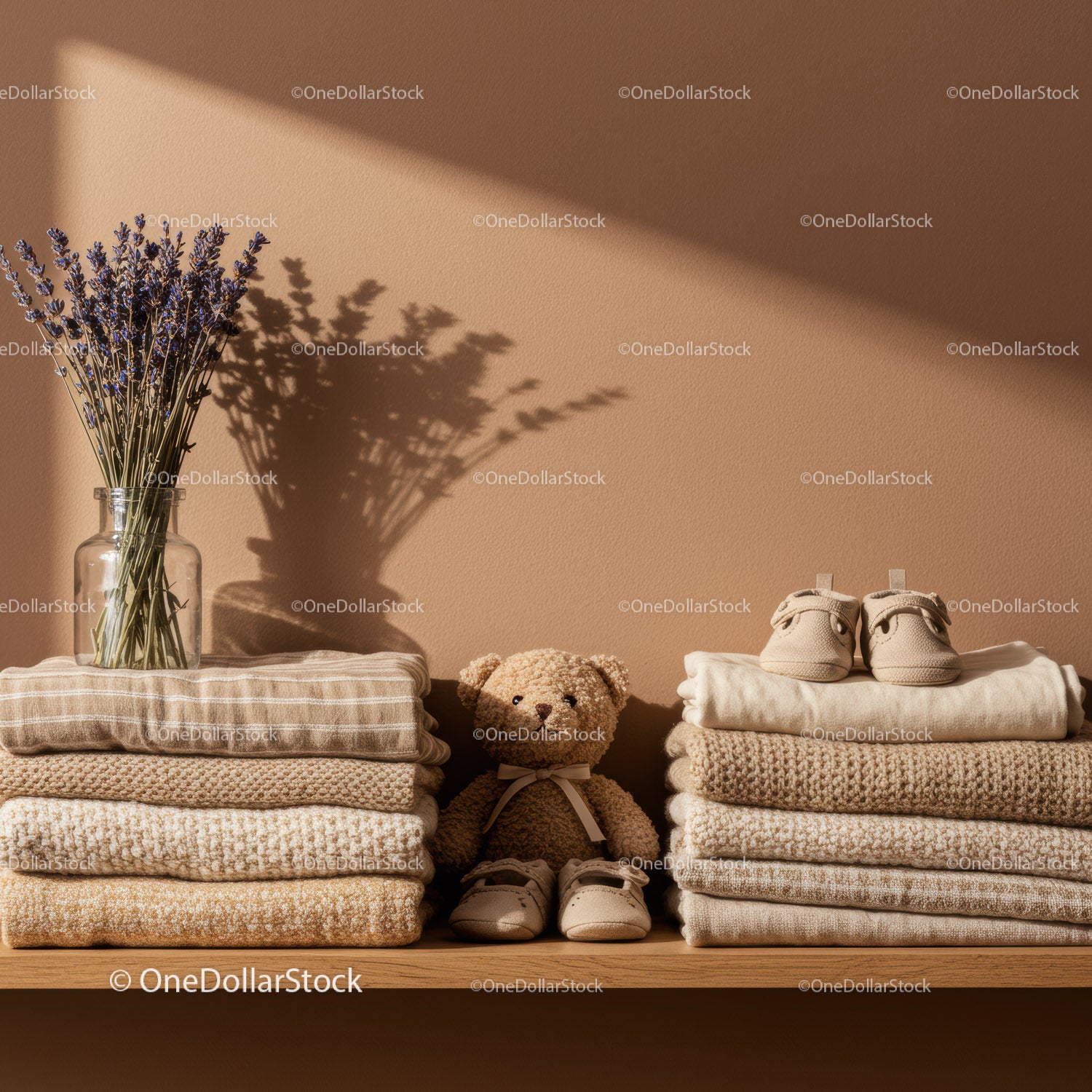 Cozy neutral baby items with lavender and teddy bear