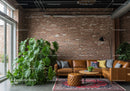 Modern Lounge Area with Leather Sofa and Large Indoor Plant in Brick-Walled Room
