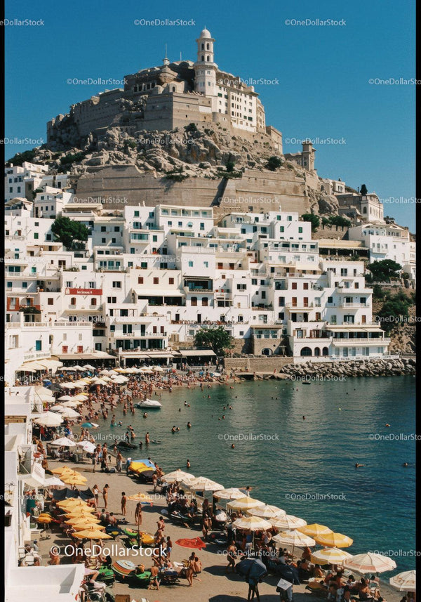 Scenic Mediterranean Coastal Village with White Buildings and Beach Scene