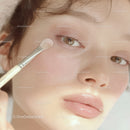 Close-up of Woman Applying Eyeshadow with Makeup Brush
