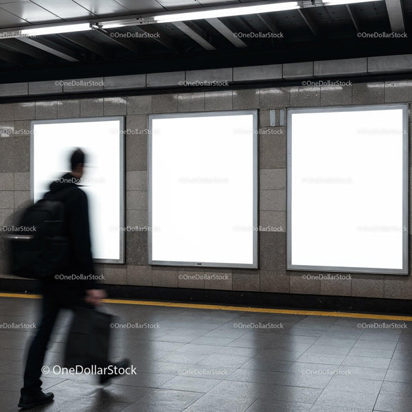 Blurred man walking past empty advertising panels JPG Mockup Image